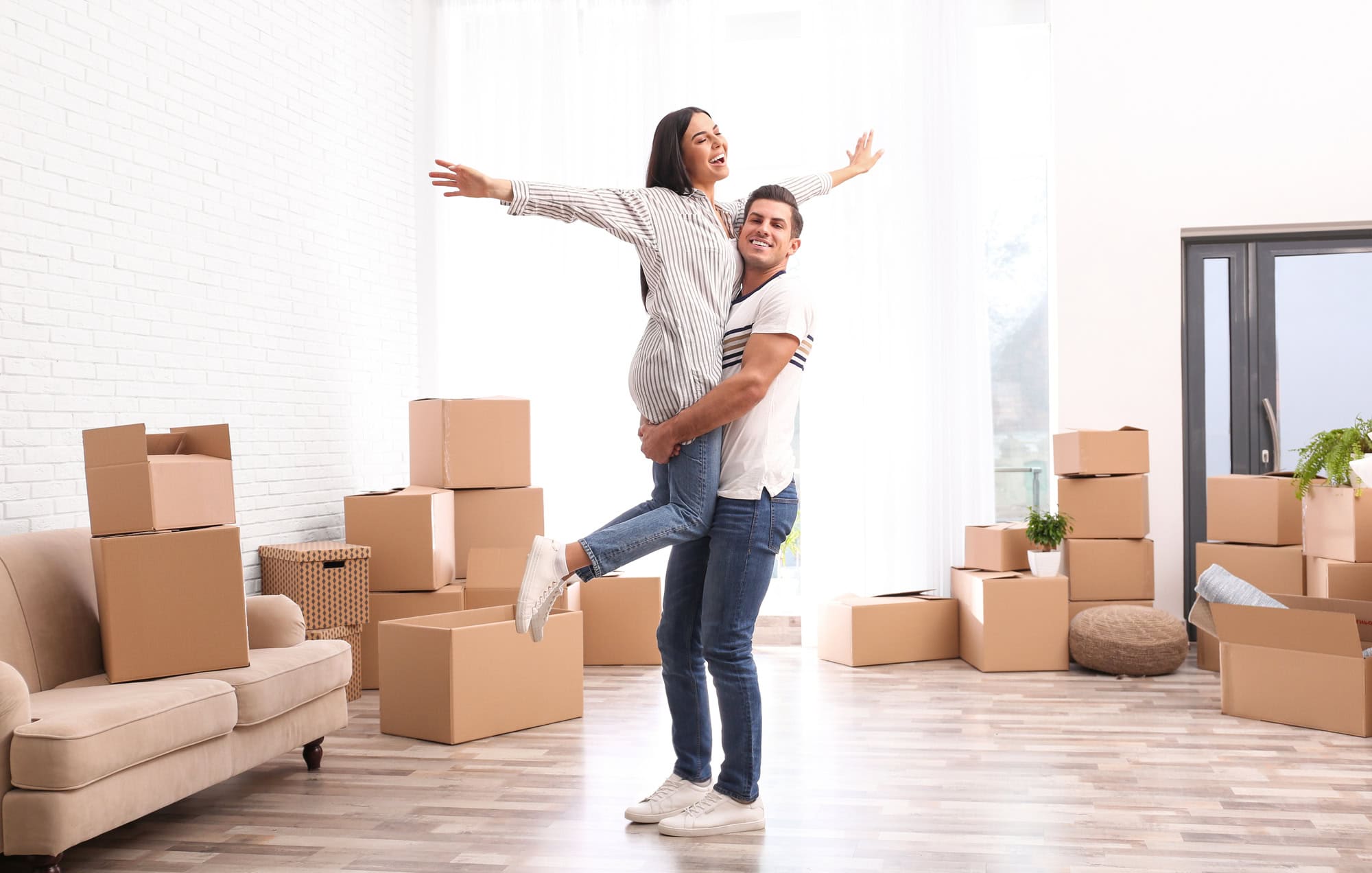Happy couple moving into new home