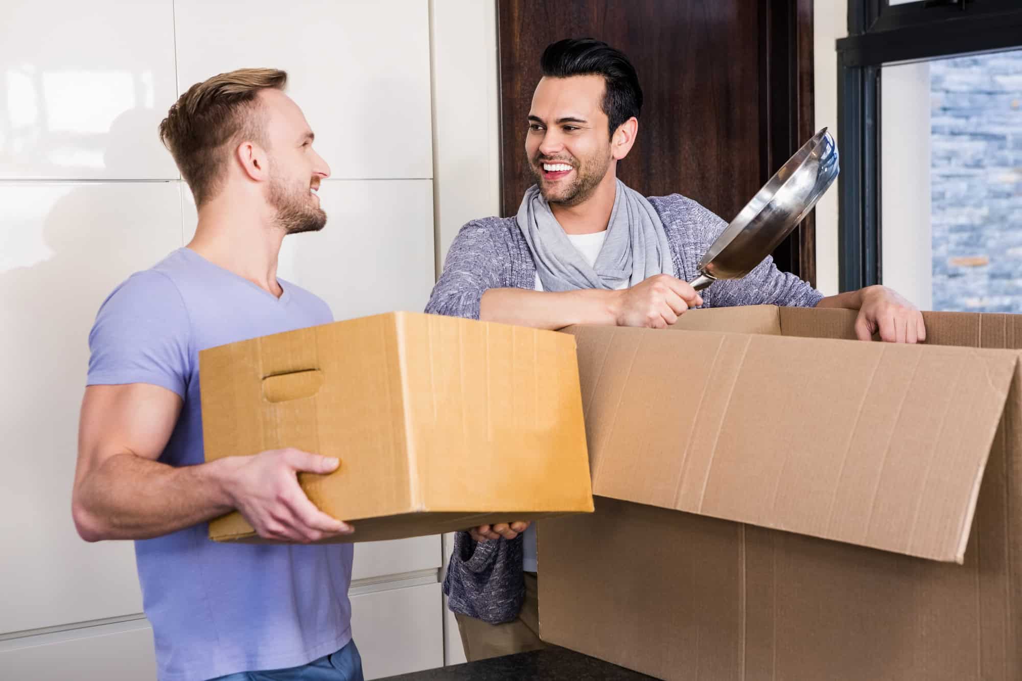Unpacking cardboard boxes in the kitchen